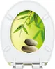 A toilet seat with a decorative image of bamboo leaves and stacked stones. Produktbild-Vorschau