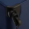 A close-up shot of a black wheel and its housing attached to a blue suitcase. Produktbild-Vorschau