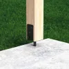 A wooden post is anchored to a concrete surface with a metal bracket and rebar. Podgląd zdjęcia produktu