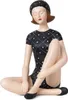 A decorative figurine of a woman in a vintage-style swimsuit and swim cap, sitting with her legs crossed. Anteprima dell’immagine prodotto