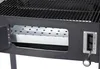A close-up view of the side of a black charcoal grill, showing the interior of the firebox and a lever mechanism. Podgląd zdjęcia produktu