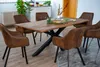 A dining table with chairs in a dining room setting. Produktbild-Vorschau