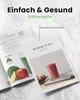 A marketing image showing a recipe book for a juicer, with a glass of juice and ingredients. Podgląd zdjęcia produktu