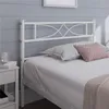 A white metal bed frame with a decorative headboard is shown in a bedroom setting. Produktbild-Vorschau