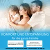 A family sleeping in bed. Produktbild-Vorschau