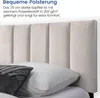 Close-up of a bed's upholstered headboard and pillows. Produktbild-Vorschau