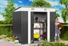 A woman stands in front of a garden shed, holding a potted plant. Náhľad obrázku produktu
