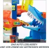 A toy car track set with a shark-themed element, showing a yellow toy car being fed to the shark. Produktbild-Vorschau