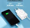 A smartphone is shown charging next to a white power adapter with two USB ports. Produktbild-Vorschau