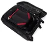 An open black suitcase with red accents, showing its interior and wheels. Podgląd zdjęcia produktu