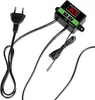 A digital thermostat with a temperature probe and a power plug. Voir les images du produit