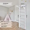 A children's indoor climbing frame mounted on a wall in a room with a teepee. Voir les images du produit