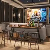 A home theater or living room setup with a large screen displaying the movie 'Avatar', a console table with drinks and snacks, and bar stools. Anteprima dell’immagine prodotto