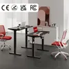 Two height-adjustable desks with laptops and chairs in an office setting. Náhled obrázku produktu