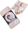 A baby swaddle is shown in packaging and also unrolled with a baby lying on it. Náhľad obrázku produktu