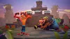 Crash Bandicoot and a crocodile-like character in a video game environment. Produktbild-Vorschau