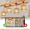 A chandelier with five lampshades is shown, with a smartphone displaying a reflection of the chandelier below. There are also icons indicating positive and negative features. Podgląd zdjęcia produktu