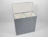 A grey woven laundry hamper with two compartments and a lid, shown against a plain background. Náhled obrázku produktu