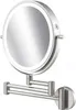 A silver, wall-mounted makeup mirror with LED lighting. Produktbild-Vorschau