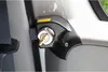 A close-up view of a black security lock with a key inserted, mounted on the interior of a vehicle. Podgląd zdjęcia produktu
