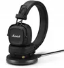 A black Marshall Major IV wireless headphone set is shown on a black charging stand. Náhľad obrázku produktu