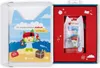 A gift box containing a children's book and a toy figure. Produktbild-Vorschau