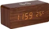 A digital alarm clock with a wooden casing and LED display. Anteprima dell’immagine prodotto