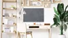 A modern home office setup with a desk, chair, shelving unit, and a large plant. Anteprima dell’immagine prodotto