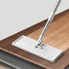 A mop head and handle are shown cleaning a wooden floor. Náhľad obrázku produktu