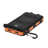 A black and orange solar power bank with a compass on a white background. Voir les images du produit