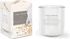 A scented candle and its packaging are displayed side-by-side against a white background. Voir les images du produit