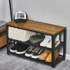 A shoe rack with a hat and accessories on top. Voir les images du produit