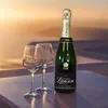 A bottle of Lanson champagne and two glasses are placed on a table with a blurred background of a sunset. Produktbild-Vorschau