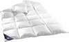 A white down comforter and pillow set is displayed on a white background. Náhled obrázku produktu
