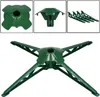 A green Christmas tree stand is shown against a white background. The image is composed of multiple views of the stand, including a top-down view, a side view, and a set of detachable legs. Voir les images du produit