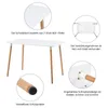 Collage of images showing details of a white rectangular table with wooden legs. Voir les images du produit