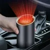 A hand holding a portable car heater in a car's center console. Anteprima dell’immagine prodotto