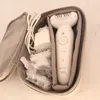 A white Braun Silk-épil 9 epilator and its accessories are neatly arranged inside a gray fabric storage case. Náhľad obrázku produktu
