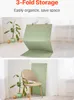 Top image shows a person demonstrating the 3-fold storage of a green mat. Bottom image shows the folded mat leaning against a chair next to a plant. Anteprima dell’immagine prodotto