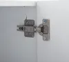 Close-up of a cabinet hinge attached to a white cabinet. Anteprima dell’immagine prodotto