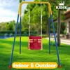 A baby swing set is shown outdoors on a grassy lawn with a house in the background. Produktbild-Vorschau