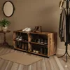 A rustic wooden shoe rack made from crates, filled with shoes, in a hallway with a mirror and coat rack. Náhled obrázku produktu