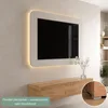 A modern living room with a wall-mounted TV and a wooden media console. Produktbild-Vorschau