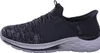 A side view of a black and gray Skechers sneaker. Anteprima dell’immagine prodotto