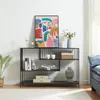 A console table with decorative items and books, placed in a living room setting. Náhľad obrázku produktu