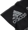 A close-up shot of a black Adidas towel with the Adidas logo in white. Produktbild-Vorschau