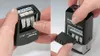 Two images showing a Trodat Printy Dater 4850L stamp being used and adjusted. Anteprima dell’immagine prodotto