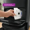 A hand is inserting a vacuum cleaner bag into a black vacuum cleaner. Anteprima dell’immagine prodotto