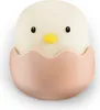 A close-up studio shot of a cute chick in an eggshell. Produktbild-Vorschau