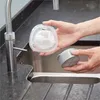 A person is holding a filter and a filter housing over a sink. Anteprima dell’immagine prodotto